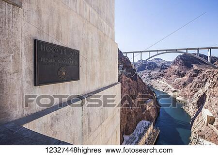 A plaque commemorating the construction of the Hoover Dam is displayed at the hoover dam lookout with a view of the Mike OCallaghan-Pat Tillman Memorial Bridge and canyon below; Arizona, United States of America View Large Photo Image Stock Photograph - A plaque commemorating the construction of the Hoover Dam is displayed at the hoover dam lookout with a view of the Mike OCallaghan-Pat Tillman Memorial Bridge and canyon below; Arizona, United States of America. Fotosearch