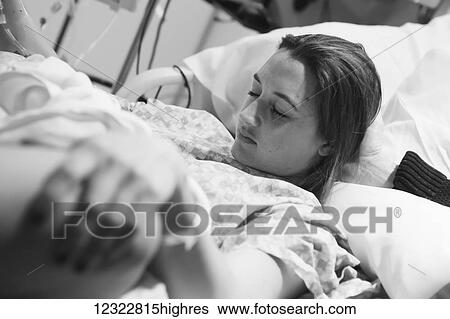 Stock Photograph - A pregnant woman in a hospital bed during labour; Oregon, United States of America. Fotosearch