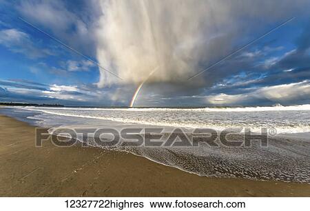 A rainbow in a storm cloud formation along the coast; South Shields, Tyne and Wear, England View Large Photo Image Stock Photograph - A rainbow in a storm cloud formation along the coast; South Shields, Tyne and Wear, England. Fotosearch