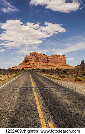 A road leading to a rugged rock formation in the desert; Arizona, United States of America View Large Photo Image Stock Photograph - A road leading to a rugged rock formation in the desert; Arizona, United States of America. Fotosearch