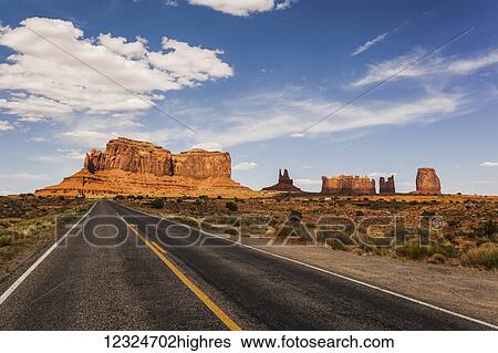 A road leading to rugged rock formations in the desert; Arizona, United States of America View Large Photo Image Stock Photograph - A road leading to rugged rock formations in the desert; Arizona, United States of America. Fotosearch