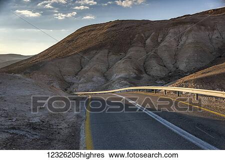 A road running through the Judean desert; Ezor Beer Sheva, South District, Israel View Large Photo Image Stock Photograph - A road running through the Judean desert; Ezor Beer Sheva, South District, Israel. Fotosearch