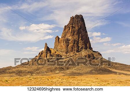 Stock Photograph - A rugged, peaked rock formation in the desert; Arizona, United States of America. Fotosearch
