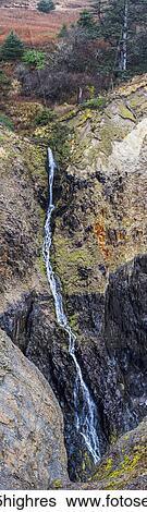 A slender waterfall plummets down the cliffs above the Devil's Cauldron; Manzanita, Oregon, United States of America View Large Photo Image Stock Photograph - A slender waterfall plummets down the cliffs above the Devil's Cauldron; Manzanita, Oregon, United States of America. Fotosearch
