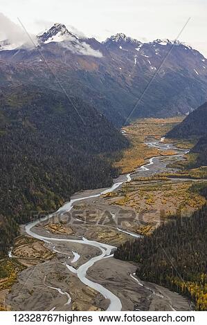 A small river flowing in a valley in the Kenai Mountains; Alaska, United States of America View Large Photo Image Stock Photograph - A small river flowing in a valley in the Kenai Mountains; Alaska, United States of America. Fotosearch