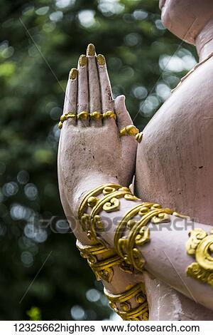 Stock Photograph - A statue at a Buddhist temple, Wat Khunaram, on the island of Ko Samui; Ko Samui, Chang Wat Surat Thani, Thailand. Fotosearch