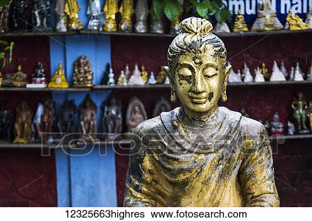 A statue at a Buddhist temple, Wat Khunaram, on the island of Ko Samui; Ko Samui, Chang Wat Surat Thani, Thailand View Large Photo Image Stock Photograph - A statue at a Buddhist temple, Wat Khunaram, on the island of Ko Samui; Ko Samui, Chang Wat Surat Thani, Thailand. Fotosearch
