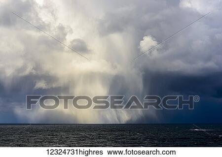 Stock Photograph - A storm dumps hail along the Oregon Coast; Manzanita, Oregon, United States of America. Fotosearch