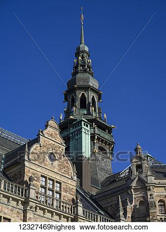 A tower with spire against a blue sky; Stockholm, Sweden View Large Photo Image Stock Photograph - A tower with spire against a blue sky; Stockholm, Sweden. Fotosearch