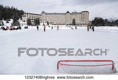 A view from behind the hockey net during a pond hockey game in the winter on frozen Lake Louise in Banff National Park, against the background of the Fairmont Chateau Lake Louise Resort; Lake Louise, Alberta, Canada View Large Photo Image Stock Photograph - A view from behind the hockey net during a pond hockey game in the winter on frozen Lake Louise in Banff National Park, against the background of the Fairmont Chateau Lake Louise Resort; Lake Louise, Alberta, Canada. Fotosearch