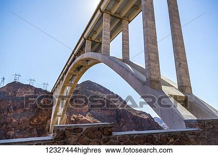 Stock Photograph - A view from beneath the Mike OCallaghan-Pat Tillman Memorial Bridge interstate bypass at the Hoover Dam; Arizona, United States of America. Fotosearch