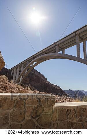 Stock Photograph - A view from beneath the Mike OCallaghan-Pat Tillman Memorial Bridge interstate bypass at the Hoover Dam; Arizona, United States of America. Fotosearch