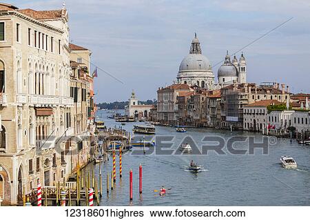 Stock Photograph - A well k0wn and popular photography spot for travelers in Venice here at the scenic Grand Canal view from Accademia Bridge; Venice, Italy. Fotosearch