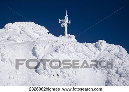 A white transmission tower on the top of a snow covered mountain; Whistler, British Columbia, Canada View Large Photo Image Stock Photograph - A white transmission tower on the top of a snow covered mountain; Whistler, British Columbia, Canada. Fotosearch
