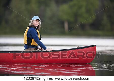 A woman canoeing on Stone Step Lake; Homer, Alaska, United States of America View Large Photo Image Stock Photograph - A woman canoeing on Stone Step Lake; Homer, Alaska, United States of America. Fotosearch