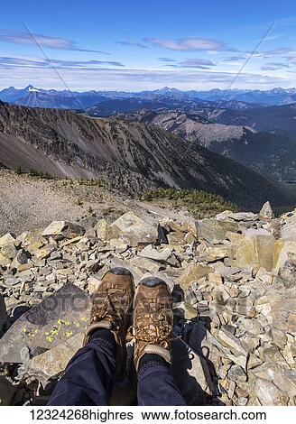 A woman's feet standing on a rock at the top of Mount Frosty, overlooking Windy Joe in E. C. Manning Provincial Park; British Columbia, Canada View Large Photo Image Stock Photograph - A woman's feet standing on a rock at the top of Mount Frosty, overlooking Windy Joe in E. C. Manning Provincial Park; British Columbia, Canada. Fotosearch