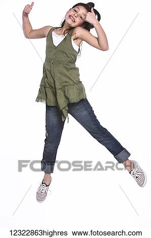A young girl with long, brunette hair leaping in the air with thumbs up on a white background; Oregon, United States of America View Large Photo Image Stock Photograph - A young girl with long, brunette hair leaping in the air with thumbs up on a white background; Oregon, United States of America. Fotosearch