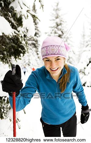 Stock Photograph - A young woman cross country skiing, Ohlson Mountain; Alaska, United States of AmericaNone. Fotosearch