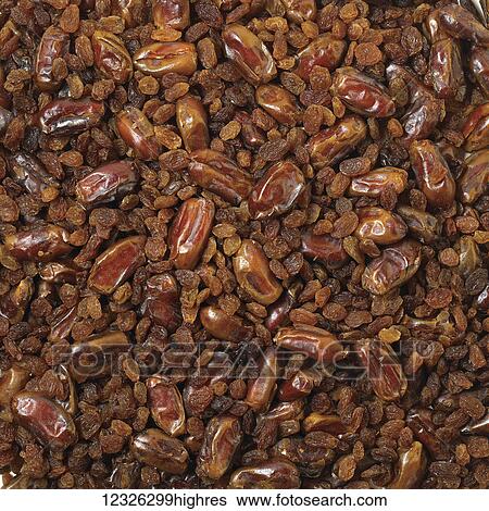 Stock Photograph - Abundance of dates and raisins. Fotosearch