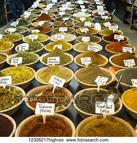 Stock Photograph - Abundant variety of spices and rice for sale at the Arab Market in the Old City of Jerusalem; Jerusalem, Israel. Fotosearch