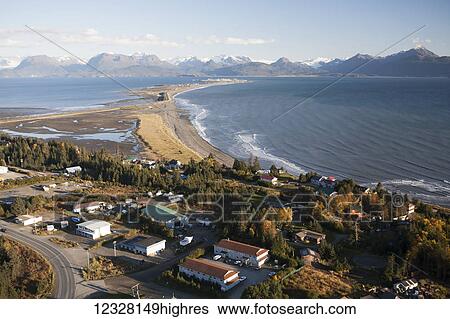 Stock Photograph - Aerial view of Homer Spit and Kachemak Bay with Kenai Mountains in the background, Southcentral Alaska, USA. Fotosearch