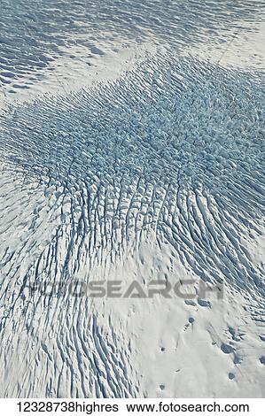 Stock Photograph - Aerial view of patterns in the snow on the mountains of Fairweather Range, Glacier Bay National Park, Gulf of Alaska; Alaska, United States of America. Fotosearch