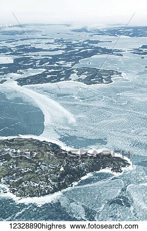 Aerial view of the frozen water and landscape in winter; Alaska, United States of America View Large Photo Image Stock Photograph - Aerial view of the frozen water and landscape in winter; Alaska, United States of America. Fotosearch