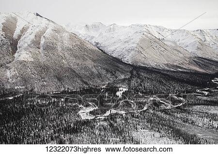 Aerial view of the Ogilvie Mountains while flying along the Dempster Highway; Yukon, Canada View Large Photo Image Stock Photograph - Aerial view of the Ogilvie Mountains while flying along the Dempster Highway; Yukon, Canada. Fotosearch