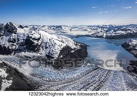 Stock Photograph - Aerial view of the west branch of Columbia Glacier with Columbia Bay in background, main branch visible in upper left, Prince William Sound; Alaska, United States of America. Fotosearch