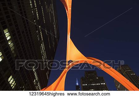 Stock Photograph - Alexander Calders Flamingo sculpture at Federal Plaza, located in front of the Kluczynski Federal Building; Chicago, Illi0is, United States of America. Fotosearch