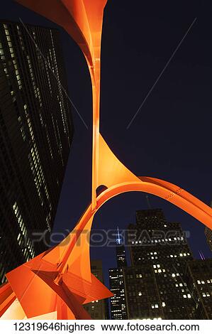 Stock Photograph - Alexander Calders Flamingo sculpture at Federal Plaza, located in front of the Kluczynski Federal Building; Chicago, Illi0is, United States of America. Fotosearch