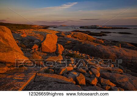 Stock Photograph - Along the High Head Trail coastline at sunset; Prospect, Nova Scotia, Canada. Fotosearch