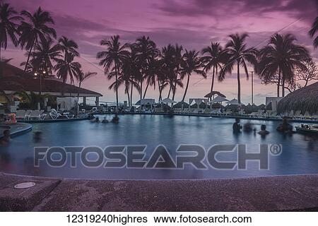 An evening swim at sunset at the pool of the Emporio Hotel; Ixtapa, Mexico View Large Photo Image Stock Photograph - An evening swim at sunset at the pool of the Emporio Hotel; Ixtapa, Mexico. Fotosearch