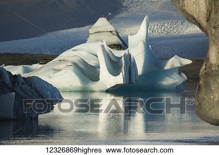An Iceberg floating in Jokulsarlon, a glacial lagoon along the South coast of Iceland; Iceland View Large Photo Image Stock Photograph - An Iceberg floating in Jokulsarlon, a glacial lagoon along the South coast of Iceland; Iceland. Fotosearch