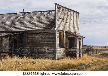 Stock Photograph - An old, abandoned wooden building on the prairies; Orion, Alberta, Canada. Fotosearch