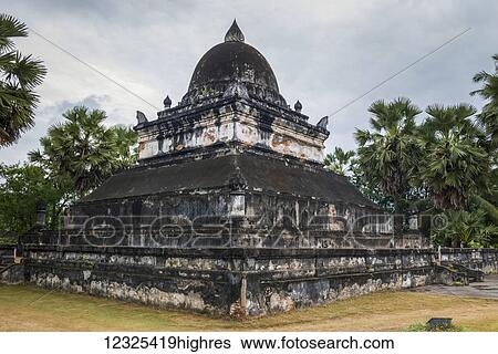 Stock Photograph - An old buddhist temple; Luang Prabang, Luang Prabang Province, Laos. Fotosearch