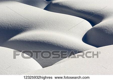 Artistic montage of snow contouring a creek bed with graphic designs of curving highlights and shadows; Lake Louise, Alberta, Canada View Large Photo Image Stock Photograph - Artistic montage of snow contouring a creek bed with graphic designs of curving highlights and shadows; Lake Louise, Alberta, Canada. Fotosearch