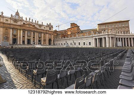 Stock Photograph - At St Peters Square in Vatican city, outdoor seating is arranged for the weekly Papal audience held on Wednesdays each week for spiritual blessing; Vatican City, Lazio, Italy. Fotosearch