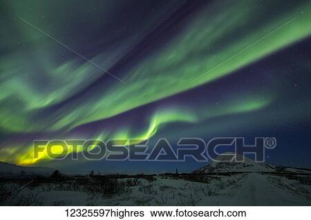 Aurora borealis dances over Donnelly Dome, south of Delta Junction; Alaska, United States of America View Large Photo Image Stock Photograph - Aurora borealis dances over Donnelly Dome, south of Delta Junction; Alaska, United States of America. Fotosearch