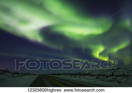 Stock Photograph - Aurora Borealis over the Richardson Highway south of Delta Junction; Alaska, United States of America. Fotosearch