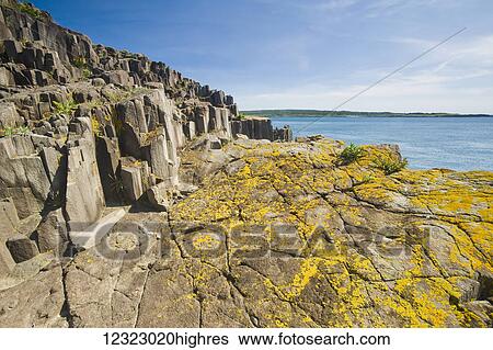 Stock Photograph - Basalt rock cliffs, Bay of Fundy; Brier Island, Nova Scotia, Canada. Fotosearch