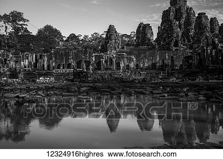 Bayon Temple reflected in water, Angkor Thom; Krong Siem Reap, Siem Reap Province, Cambodia View Large Photo Image Stock Photograph - Bayon Temple reflected in water, Angkor Thom; Krong Siem Reap, Siem Reap Province, Cambodia. Fotosearch
