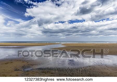 Big coastal skies over the ocean and beach, North East coast of England; Sunderland, Tyne and Wear, England View Large Photo Image Stock Photograph - Big coastal skies over the ocean and beach, North East coast of England; Sunderland, Tyne and Wear, England. Fotosearch