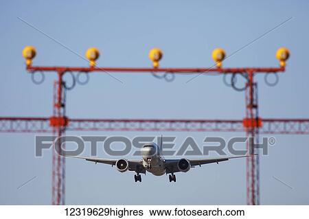 Stock Photograph - Boeing 777 wide-bodied jetliner on approach to Lester B. Pearson International Airport; Mississauga, Ontario, Canada. Fotosearch