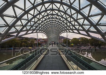Bridge of Peace, a bow-shaped pedestrian bridge over the Mtkvari (Kura) River; Tbilisi, Georgia View Large Photo Image Stock Photograph - Bridge of Peace, a bow-shaped pedestrian bridge over the Mtkvari (Kura) River; Tbilisi, Georgia. Fotosearch