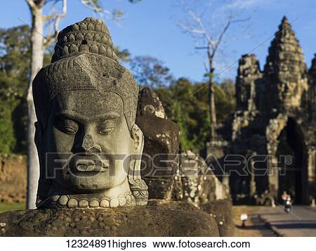 Buddhist statue, South Gate, Angkor Thom; Krong Siem Reap, Siem Reap Province, Cambo View Large Photo Image Stock Photograph - Buddhist statue, South Gate, Angkor Thom; Krong Siem Reap, Siem Reap Province, Cambo. Fotosearch
