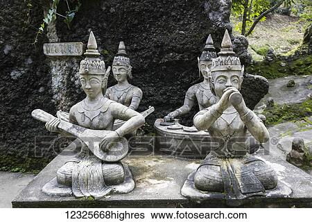 Stock Photograph - Buddhist statues playing musical instruments in Secret Buddha Garden; Ko Samui, Chang Wat Surat Thani, Thailand. Fotosearch