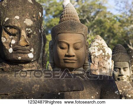 Buddhist statues, South Gate, Angkor Thom; Krong Siem Reap, Siem Reap Province, Cambodia View Large Photo Image Stock Photograph - Buddhist statues, South Gate, Angkor Thom; Krong Siem Reap, Siem Reap Province, Cambodia. Fotosearch