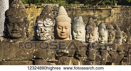 Buddhist statues, South Gate, Angkor Thom; Krong Siem Reap, Siem Reap Province, Cambodia View Large Photo Image Stock Photograph - Buddhist statues, South Gate, Angkor Thom; Krong Siem Reap, Siem Reap Province, Cambodia. Fotosearch