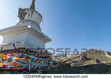 Buddhist stupa and Tibetan flags on the road near Litang village, first Tibetan town from Chengdu; Litang, Sichuan, China View Large Photo Image Stock Photograph - Buddhist stupa and Tibetan flags on the road near Litang village, first Tibetan town from Chengdu; Litang, Sichuan, China. Fotosearch